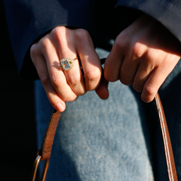 Ring met sky blue topaas, peridoot prinsessenslijpsel en briljant